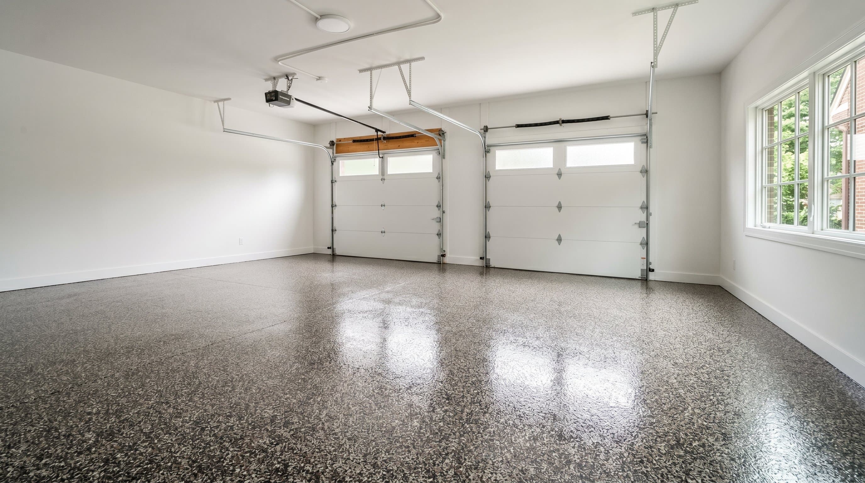 Ann Arbor garage with flake epoxy in charcoal, cream, copper.