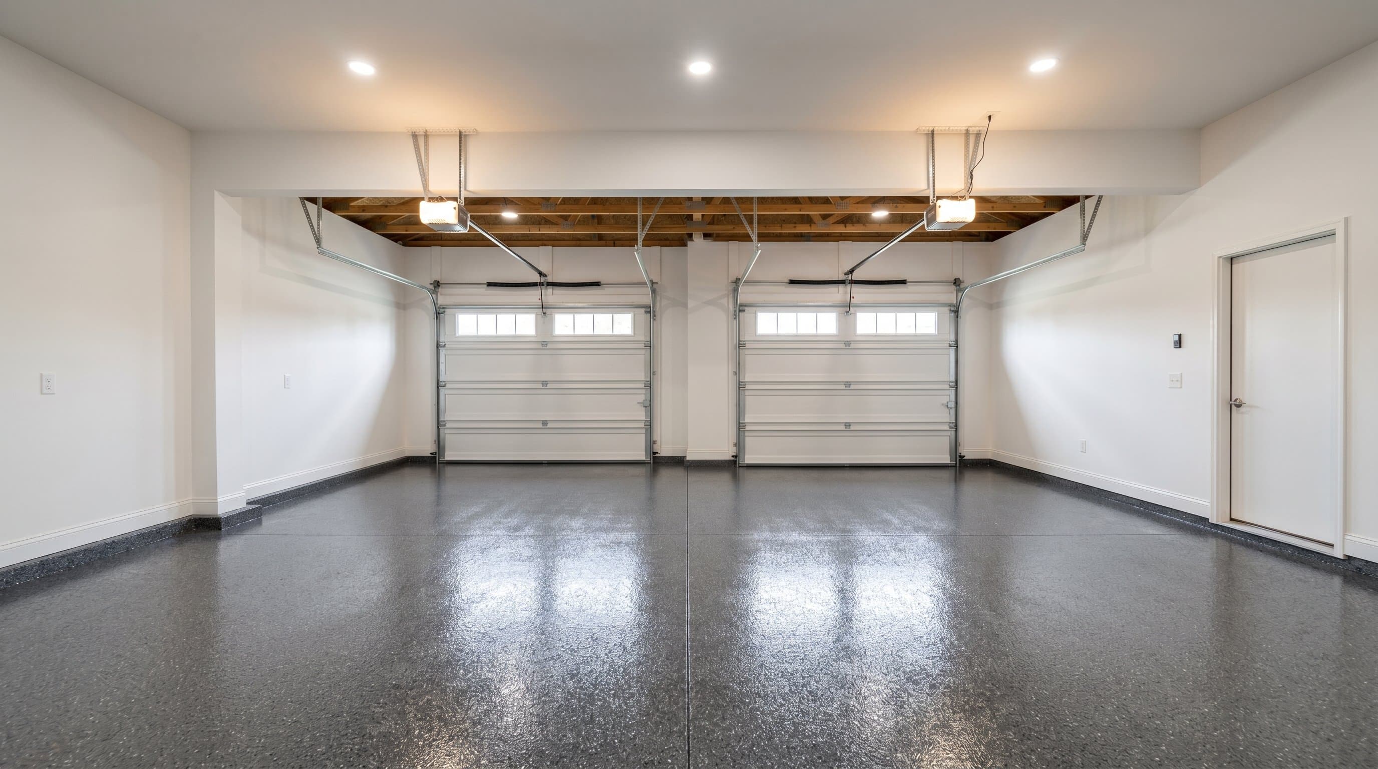 Ann Arbor garage after recoat with a charcoal flake floor.