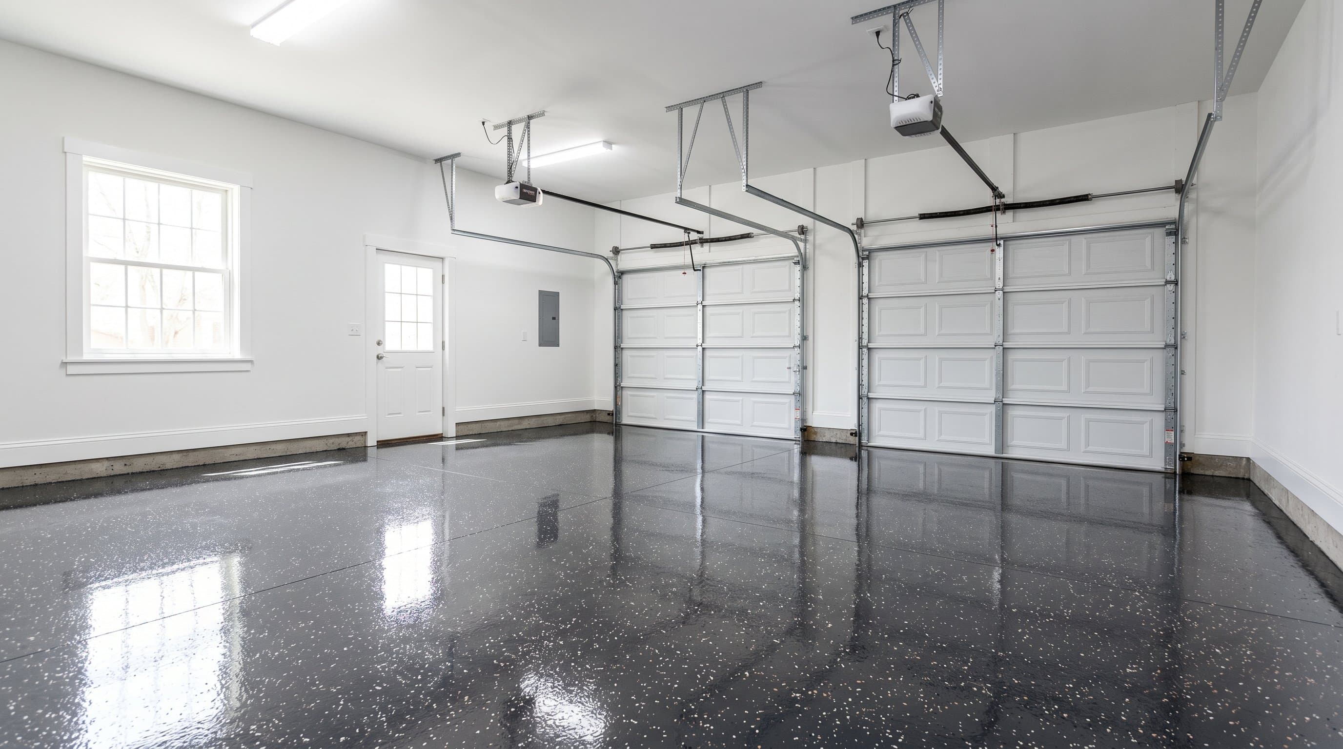 Dark slate epoxy floor with full flake broadcast in a finished Ann Arbor garage, Michigan.